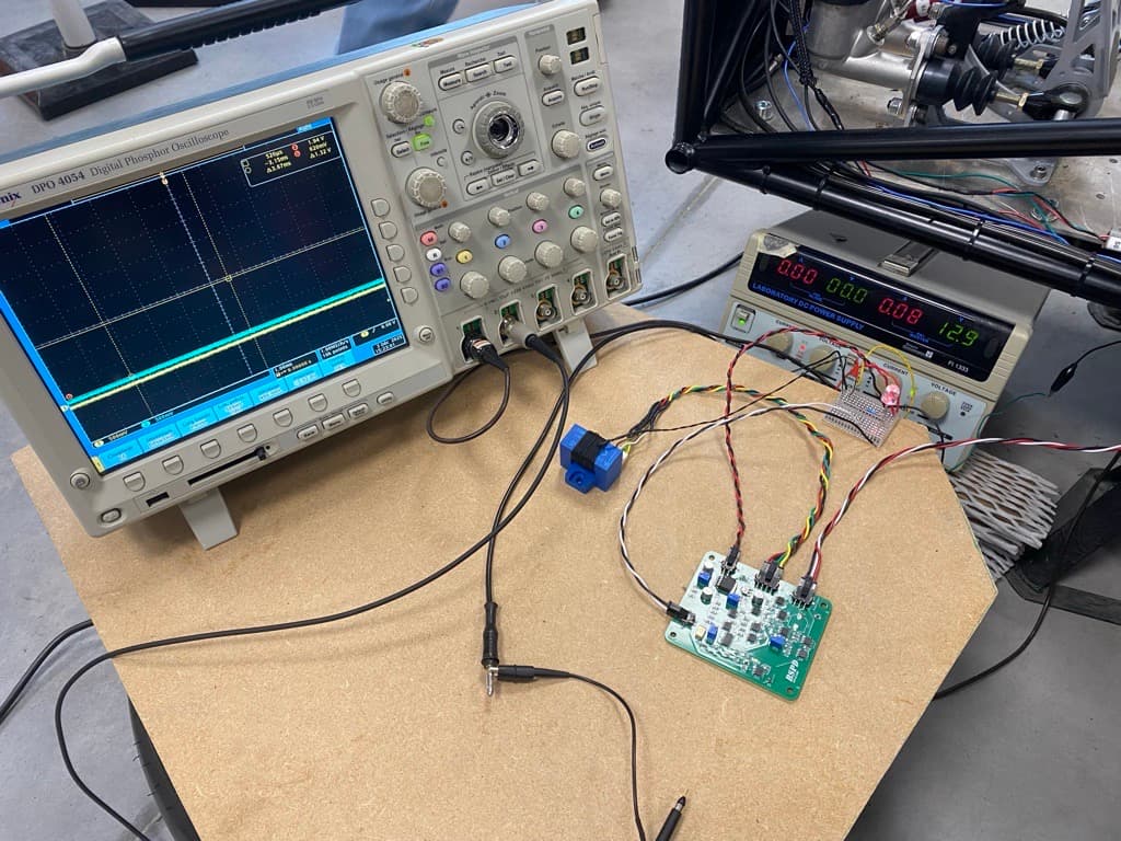 Oscilloscope and laboratory supply used for vehicle-integrated BSPD current-channel testing