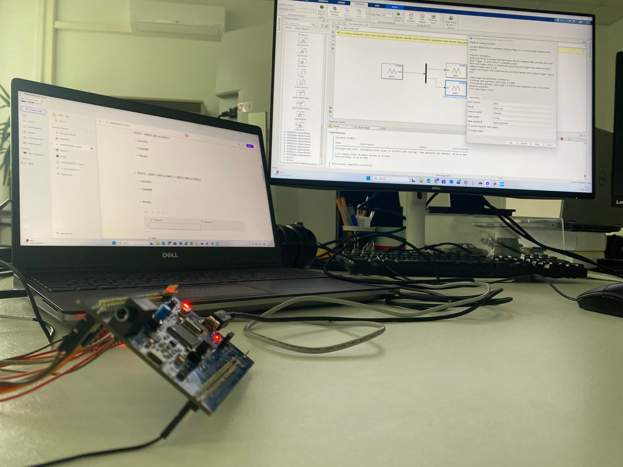 STM32 prototype connected to a Simulink test setup during experimental validation
